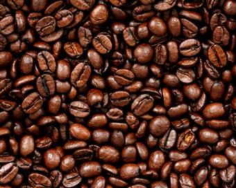 a close up of dark coffee beans showcasing their rich texture and color ideal for six distinct blends and brewing methods