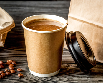 coffee cup with lid beside coffee beans on wooden table delicious beverage five flavors to enjoy